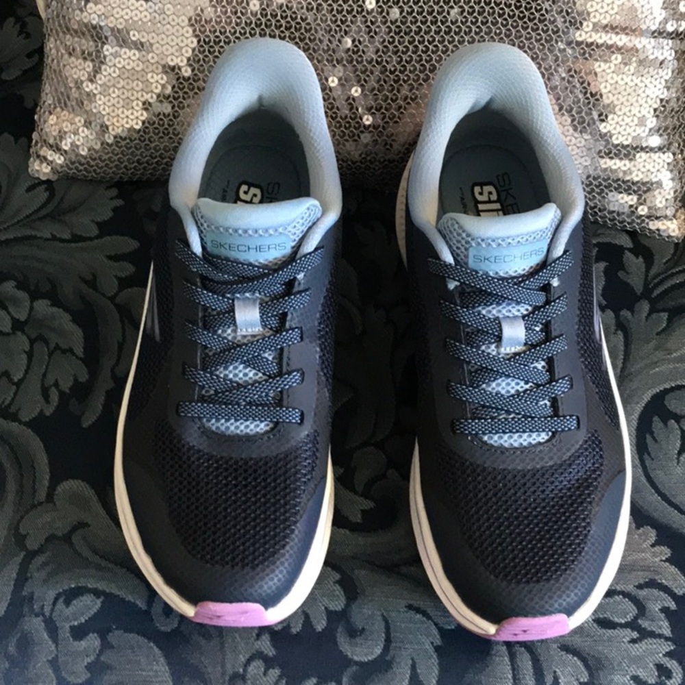 Great pair of navy blue slip in Sketchers. Worn twice. Size 7.  Ladies